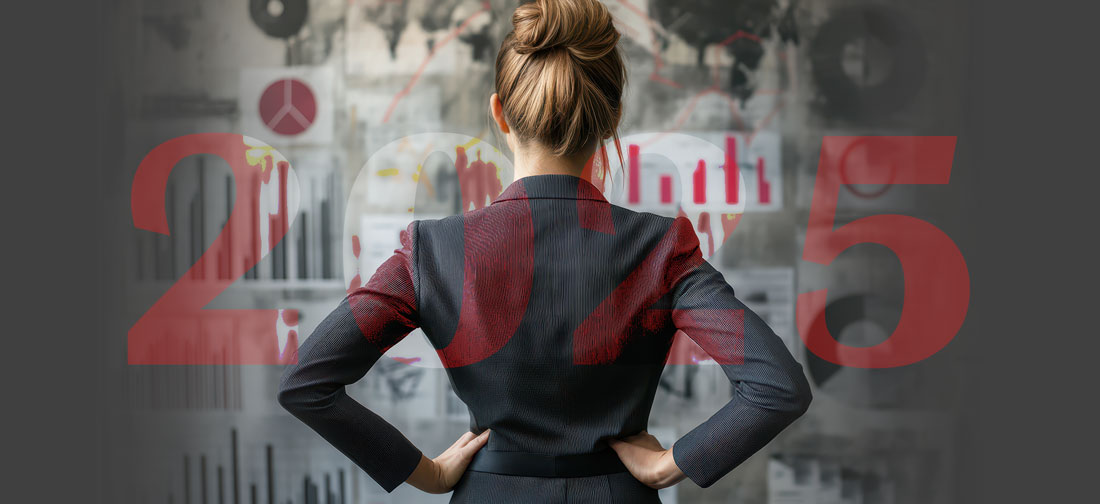 woman-in-front-of-reports-board2025 Woman standing in front of charts