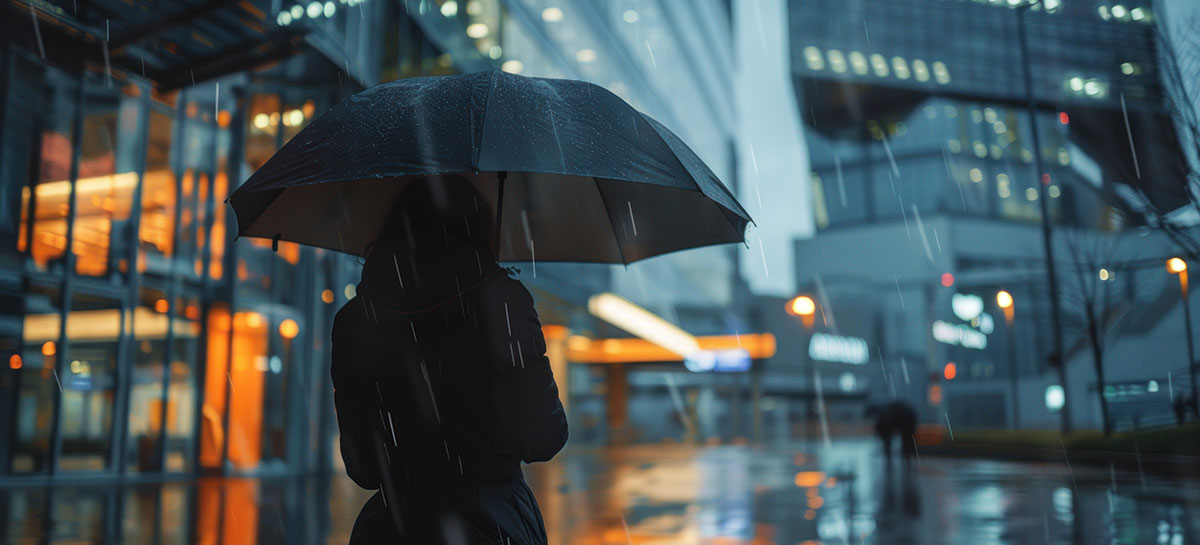 Businesswoman holding umbrella