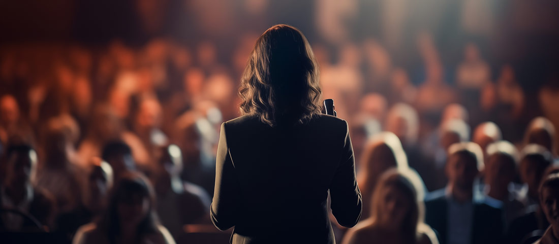 Woman speaking at a podium